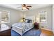Relaxing bedroom features a bed, end tables, and natural light at 663 Foxcroft Circle Se, Marietta, GA 30067