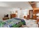 Cozy bedroom with ceiling fan, patterned quilt, and two bedside lamps at 663 Foxcroft Circle Se, Marietta, GA 30067