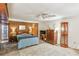 Well lit bedroom features a ceiling fan, multiple lamps, and ample closet space at 663 Foxcroft Circle Se, Marietta, GA 30067