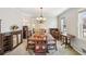 Formal dining room with a chandelier, large table, and ample seating for gatherings at 663 Foxcroft Circle Se, Marietta, GA 30067