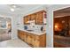 Charming kitchen featuring knotty pine cabinets, white countertops, and tiled backsplash at 663 Foxcroft Circle Se, Marietta, GA 30067