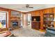 Inviting living room featuring wood paneling, fireplace, and hardwood floors at 663 Foxcroft Circle Se, Marietta, GA 30067