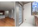 View from the doorway to the balcony, showcasing an open-concept interior layout and scenic outdoor access at 901 Abernathy Ne Rd # 3220, Sandy Springs, GA 30328