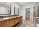 Bathroom boasts double vanity with granite countertop, tile floor, and walk-in closet access at 901 Abernathy Ne Rd # 3220, Sandy Springs, GA 30328
