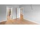 Bedroom with hardwood floors and multiple doorways showcasing the layout at 901 Abernathy Ne Rd # 3220, Sandy Springs, GA 30328