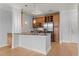 Partial Kitchen with stainless steel appliances, granite countertops, breakfast bar, and custom cabinets at 901 Abernathy Ne Rd, Sandy Springs, GA 30328