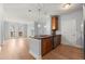 Open concept kitchen with granite counters, stainless steel appliances, hardwood flooring, and natural light at 901 Abernathy Ne Rd # 3220, Sandy Springs, GA 30328