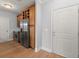 Kitchen with stainless steel appliances, wood cabinets, wine rack, and hardwood floors at 901 Abernathy Ne Rd # 3220, Sandy Springs, GA 30328