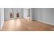 Bright living area featuring hardwood floors, double doors, and neutral paint at 901 Abernathy Ne Rd # 3220, Sandy Springs, GA 30328