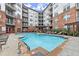Beautiful swimming pool surrounded by lounge chairs and greenery, creating a serene outdoor retreat at 901 Abernathy Ne Rd # 3220, Sandy Springs, GA 30328