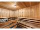 Wooden sauna with seating and rocks, offering a relaxing and rejuvenating spa experience at home at 901 Abernathy Ne Rd # 3220, Sandy Springs, GA 30328