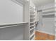 Walk-in closet featuring installed shelving for optimum storage and organization at 901 Abernathy Ne Rd # 3220, Sandy Springs, GA 30328