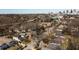 An aerial view of the neighborhood property in a neighborhood setting, with the city skyline in the distance at 999 Washington Sw St, Atlanta, GA 30315
