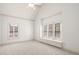 Well-lit bedroom with large window and neutral carpet at 2480 Flint Creek Dr, Cumming, GA 30041