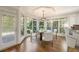 Bright breakfast nook featuring floor-to-ceiling windows and an elegant chandelier at 2480 Flint Creek Dr, Cumming, GA 30041