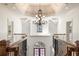 Grand foyer showcases staircase with decorative iron railing and a chandelier at 2480 Flint Creek Dr, Cumming, GA 30041