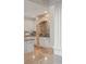 Kitchen detail featuring white cabinets and a stone alcove with range, enhanced by granite countertops at 2480 Flint Creek Dr, Cumming, GA 30041