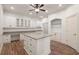 Gourmet kitchen featuring an island, hardwood floors, and abundant counter space at 2480 Flint Creek Dr, Cumming, GA 30041