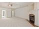 Spacious main bedroom features a fireplace and neutral carpet at 2480 Flint Creek Dr, Cumming, GA 30041