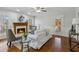 Cozy living room with a fireplace, hardwood flooring, and lots of natural light at 2607 Westchester Se Pkwy, Conyers, GA 30013