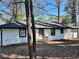 Rear exterior view of a painted brick home with a dark roof and trim at 3147 Bellgreen Way, Decatur, GA 30032