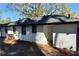 Exterior back of home with painted brick, dark window trim, and a new roof at 3147 Bellgreen Way, Decatur, GA 30032