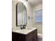 Bathroom boasting a dark wood vanity, white marble countertop, and modern black faucet at 3147 Bellgreen Way, Decatur, GA 30032