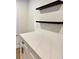 Close-up of kitchen featuring sleek cabinets and quartz countertops at 3147 Bellgreen Way, Decatur, GA 30032