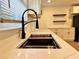 Close-up of the kitchen sink with a modern faucet and quartz countertops at 3147 Bellgreen Way, Decatur, GA 30032