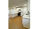 Modern kitchen featuring white cabinetry, an island, and stainless steel appliances at 3147 Bellgreen Way, Decatur, GA 30032