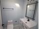 The remodeled bathroom boasts a modern vanity with a rectangular mirror and stylish lighting at 346 Carpenter Drive Ne Dr # 32, Sandy Springs, GA 30328