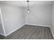 A gray dining room with new floors and modern lighting at 346 Carpenter Drive Ne Dr # 32, Sandy Springs, GA 30328