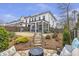 View of backyard with patio, landscaping and screened porch at 347 Bailey Walk, Alpharetta, GA 30009