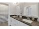 Bathroom with double sinks and granite counters at 347 Bailey Walk, Alpharetta, GA 30009