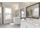 Bright bathroom with double vanity, large mirrors, and a view of the shower at 347 Bailey Walk, Alpharetta, GA 30009