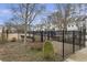 A fenced community park is surrounded by townhomes at 347 Bailey Walk, Alpharetta, GA 30009