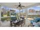 Screened porch with dining and seating areas overlooking fenced yard at 347 Bailey Walk, Alpharetta, GA 30009