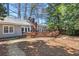 Spacious backyard with a wooden deck perfect for outdoor gatherings and summer barbecues at 436 Carolwood Ln, Atlanta, GA 30342