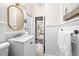 Updated bathroom features a vanity sink, wainscotting, and stylish fixtures and hardware at 436 Carolwood Ln, Atlanta, GA 30342