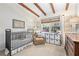 Bedroom featuring wood beam ceilings, neutral decor, crib, and comfortable furnishings at 436 Carolwood Ln, Atlanta, GA 30342