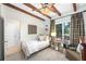 Bright bedroom featuring wood beam ceilings, classic decor, and comfortable furnishings at 436 Carolwood Ln, Atlanta, GA 30342