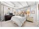 Cozy bedroom with white walls, beamed ceilings, plush bedding, and a ceiling fan at 436 Carolwood Ln, Atlanta, GA 30342