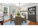 Charming dining room with woven chairs, and a view to the back deck and back yard at 436 Carolwood Ln, Atlanta, GA 30342