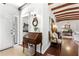 Stylish entryway showcases wood floors, a vintage desk, and views into the adjacent rooms at 436 Carolwood Ln, Atlanta, GA 30342