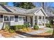 Inviting home exterior with black shutters, tidy landscaping, and a welcoming front porch at 436 Carolwood Ln, Atlanta, GA 30342