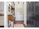 Welcoming foyer with hardwood floors, antique furniture, and views of the kitchen at 436 Carolwood Ln, Atlanta, GA 30342