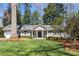 Charming single-story home featuring a well-manicured lawn and traditional architectural details at 436 Carolwood Ln, Atlanta, GA 30342