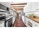 Bright, updated kitchen features white cabinetry, butcher block counters, and stainless steel appliances at 436 Carolwood Ln, Atlanta, GA 30342
