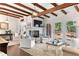 Inviting living room with exposed wood beams, fireplace, and access to a deck at 436 Carolwood Ln, Atlanta, GA 30342