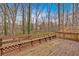 A wooden deck with railing, perfect for outdoor entertaining and relaxation at 815 Oxford Hall Dr, Lawrenceville, GA 30044
